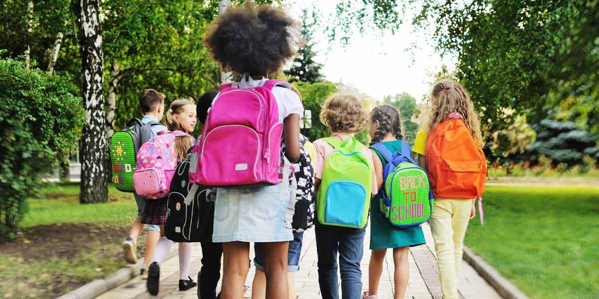 Children Walking to School with Backpacks