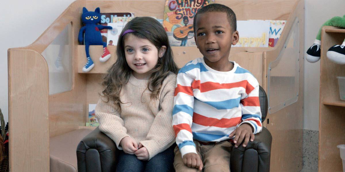 Two Children Sitting in a Chair