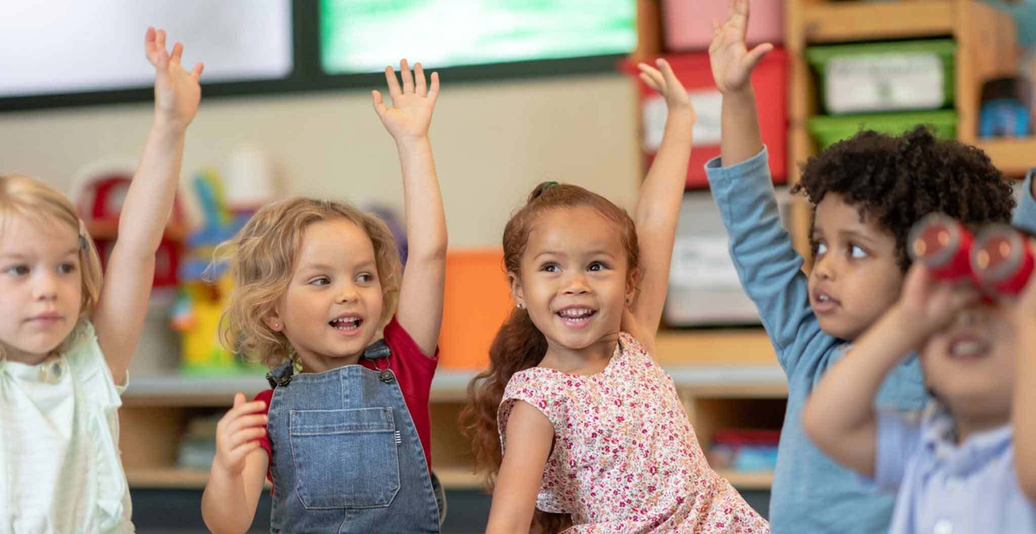 Children Raising Their Hands in Class