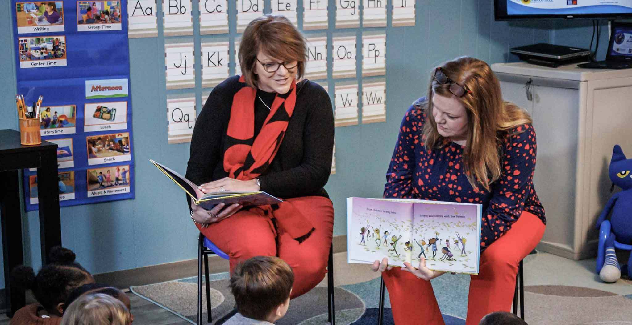 Teachers Reading Book to Children